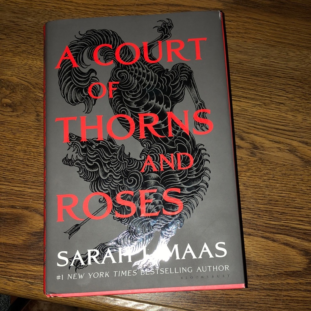 A Court of Thrones and Roses hardcover book